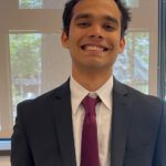 Prithvi smiling in a suit