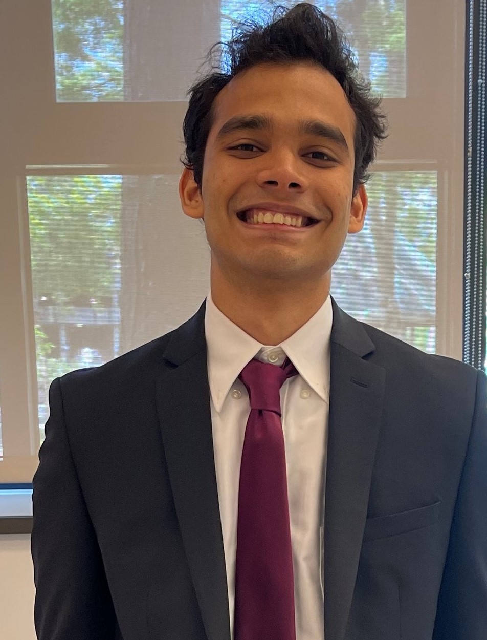Prithvi smiling in a suit