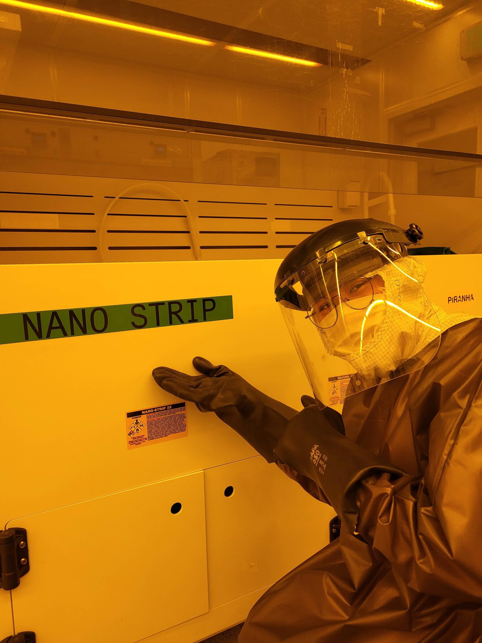 Jimmy is posing in the clean room covered in safety gear.